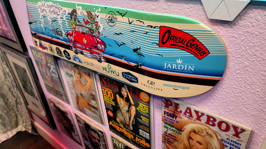 Painted skate deck and framed magazines