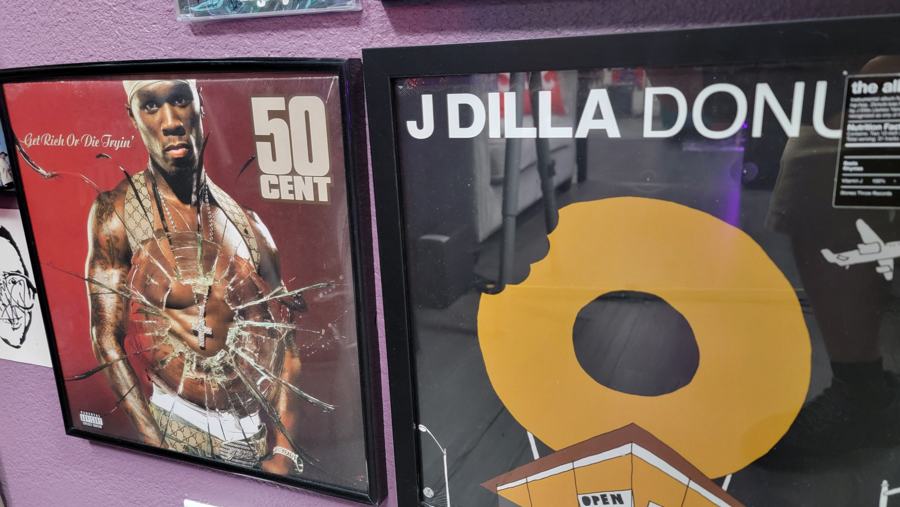 Framed 50 Cent poster and J Dilla Donuts record art